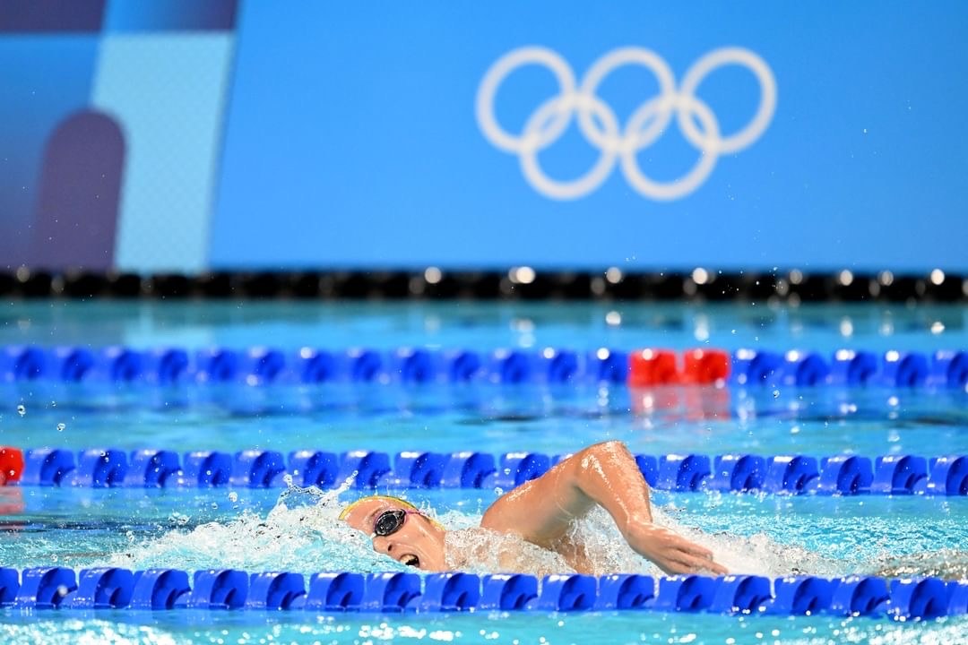 Jamie Perkins OAM Agency X Talent mid-stroke in the pool at the Paris 2024 Olympic Games