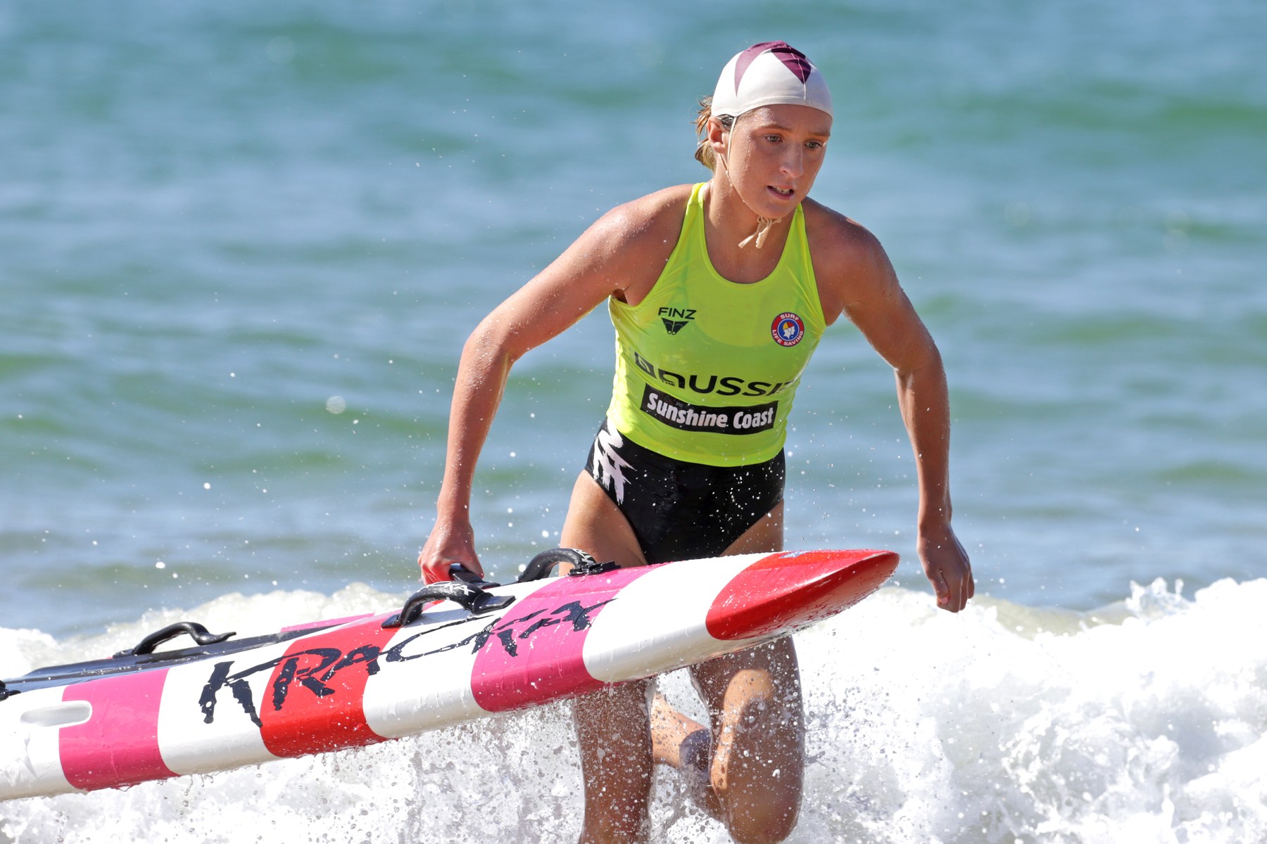 Jamie Perkins OAM Agency X Talent racing through the surf in her first sport, surf lifesaving
